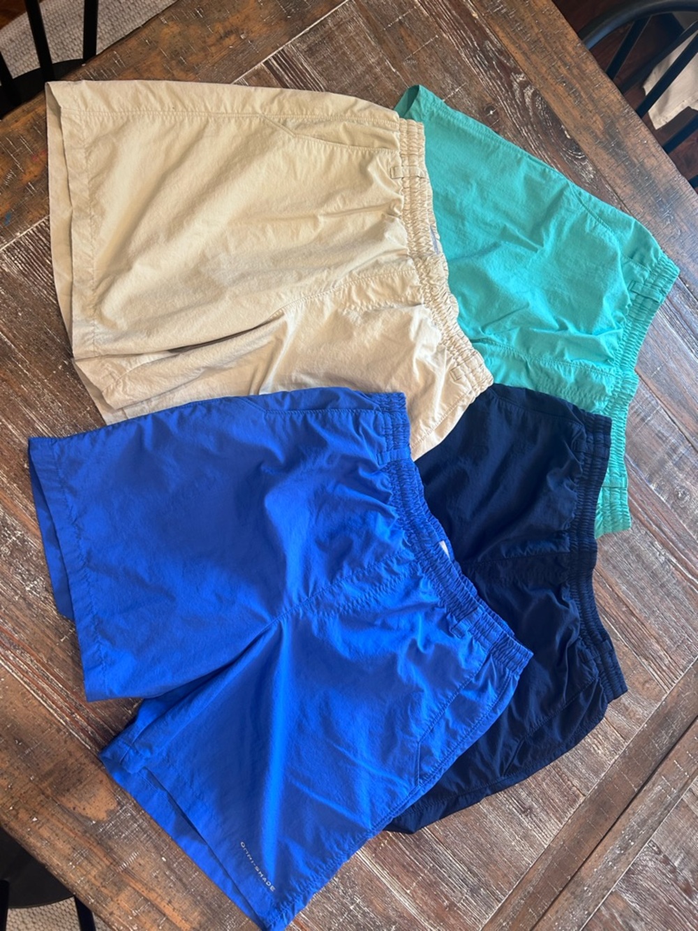 Columbia Kids 4 pair of Shorts - Blue, Navy, Teal, and Khaki. No stains or tears